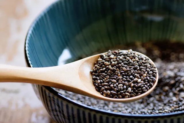 Chia seeds on wooden spoon