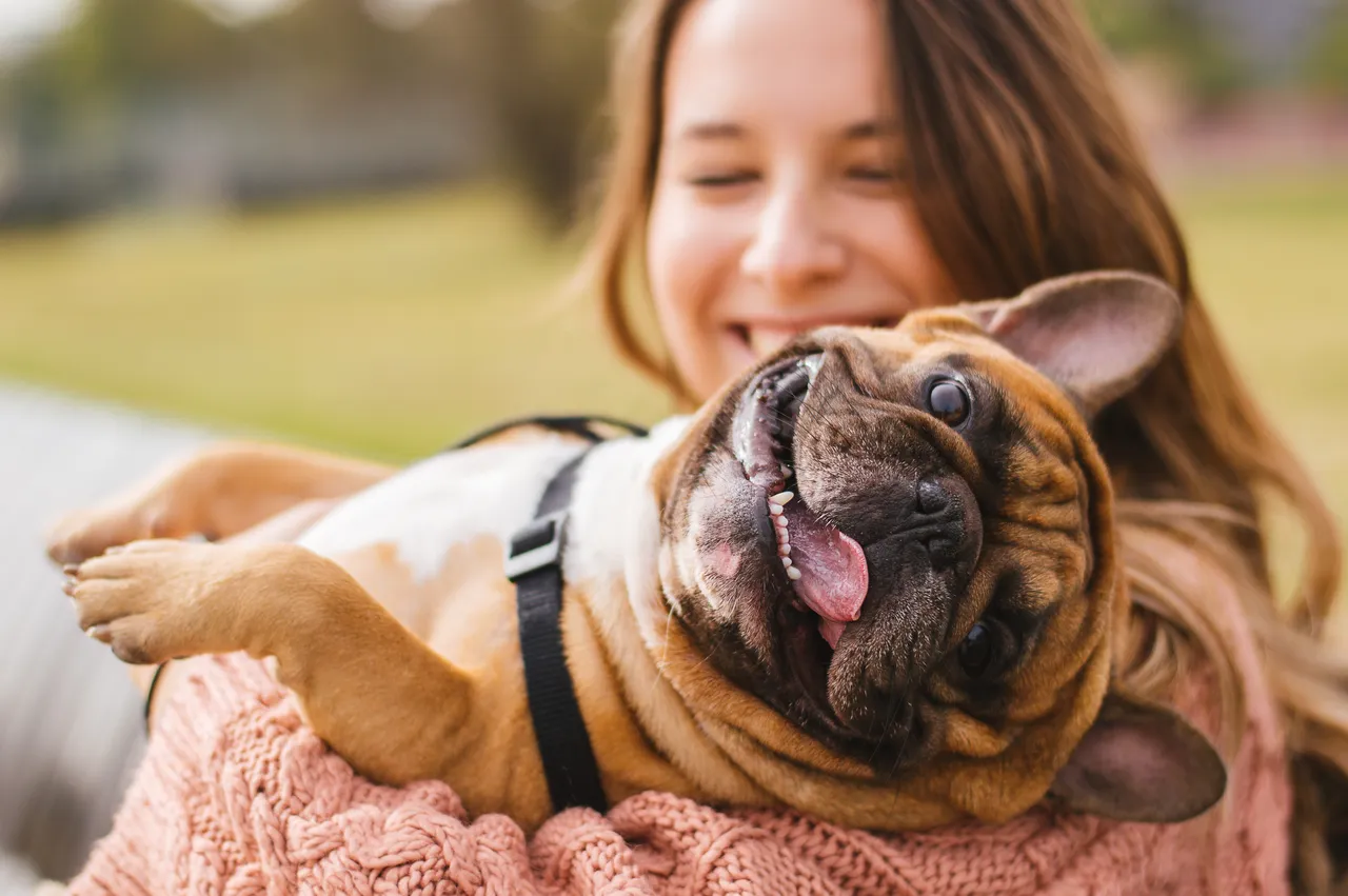Woman hugging a dog
